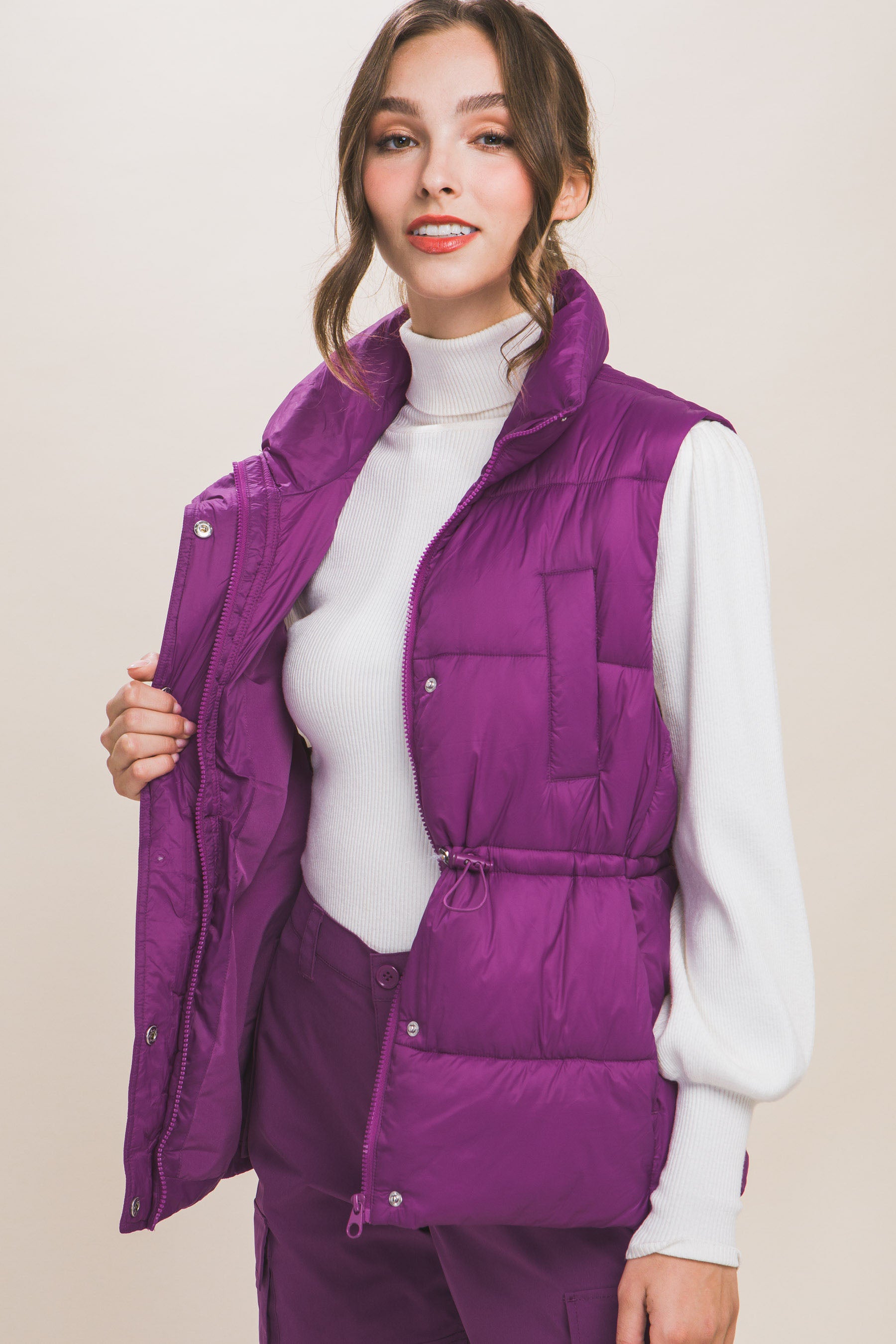 Zip Up Button Puffer Vest With Waist Toggles.