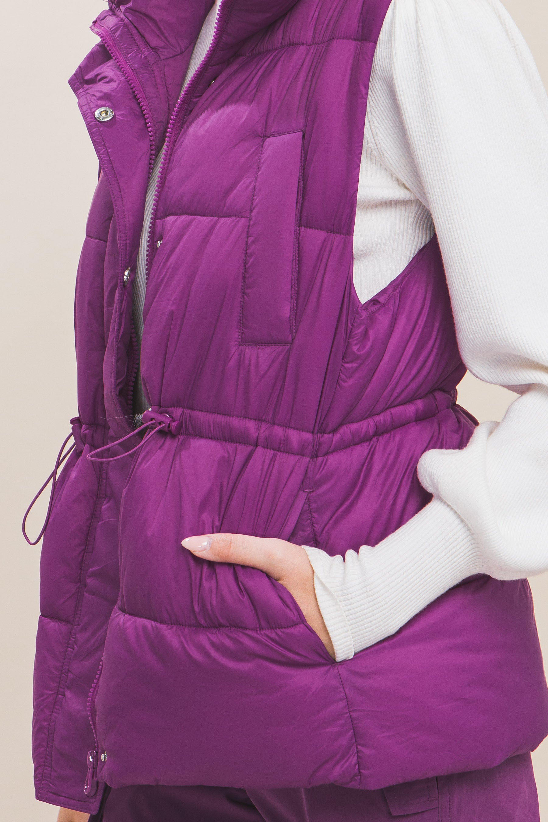 Zip Up Button Puffer Vest With Waist Toggles.